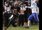 Junior quarterback Bryce Irsfeld (12) gave the Tigers an outside threat in the run game, picking up several big gains against New York Mills.