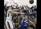 B/EV senior Bryce Irsfeld (L) made a pass with LPGE junior Blake Fossland (R) defending him during Thursday’s Prairie Conference matchup.