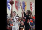 Senior guard Cody Lisson (R) defended against a shot attempt by Pine River-Backus’ Kiel Struss (L).