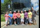 Chris Petron and Pat Gray, Christie Home Historical Society tour guides are flanked by visitors from New York Mills.