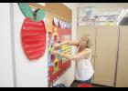 Jan Pederson readies her classroom at the LPGE Elementary School.