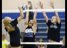 LPGE’s Sarah Anderson (M) and Emma Liebsch (R) go up for a block against B/EV’s Jenna Kunerth (L) during last Tuesday’s Prairie Conference Jamboree.