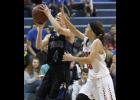 Thunder senior Claire Libesch (L) went up for a layup against B/EV seventh grader Alyah Abrahamson (R).