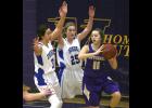 Maddie Zastrow (L) and Rachel Middendorf (M) play defense against Melrose’s Cassie Klaphake (R). The Thunder held Melrose to just 18 first half points.
