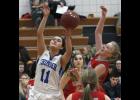 Senior Kimberly Estrada (11) was fouled on her way to the basket during Thursday’s loss at Osakis.