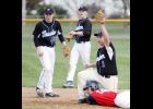 From left: Sam Olson, Matt Roe, Jaden Evenson, and Prep’s Nick Foss look for a ruling after Evenson placed the tag on Foss on a stolen base attempt.