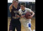 LPGE sophomore Gabe Abraham (R) drove to the hoop against a defending Tanner Rieland (L) in Sauk Centre on Saturday.