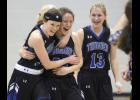 From left: Taylor Kingston, Carolyn Dinkel, and Emma Liebsch were all smiles after the final buzzer sounded last Thursday. Dinkel’s two free throws with three seconds left capped off a wild second half comeback for the Thunder.