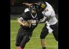 Junior fullback Will Koetters attempted to shake off a UNC tackler after catching a pass.