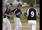 From left: Will Koetters, Hudson Pung, and Ausitn Evenson celebrate after Pung scored the game winning run on Sam Olson’s double.