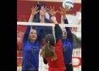 LPGE’s Emma Liesbch (L) and Carolyn Dinkel (R) went up for a block against Upsala’s Laura Lange (M).