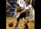 Cody Marcyes drove hard to the basket against a Pierz defender during last Saturday’s afternoon game.