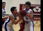 Luke Gustafson (L) and Mitchell Middendorf (R) both go for a loose ball during the Thunder’s win over Upsala last Friday night.