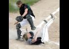 Matt Roe had to slide into home plate awkwardly to avoid getting hit by the catcher after a high throw to the plate.