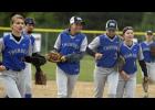 From left: Kayla Drevlow, Katrina Blommel, Ally Ecker, Raelyn Miller, and Tristen Marcyes run back to the dugout following their win against Royalton in game one.