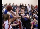 Jesse Warner attacked the basket during the first half against West Central Area. The senior finished with nine points for the Thunder.