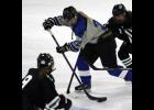 Kenzie Christianson fought for control of the puck during the Blue Devils’ game against LDC last Thursday. The junior forward scored the lone goal for Prairie Centre against LDC after putting two in the net against Morris/Benson.