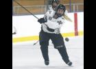 Senior wing Kenzie Christianson fired a shot on goal during the third period of play in last Friday’s game with Marshall.
