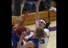 Swanville’s Troy Evans drove to the hoop against a pair of Kimball defenders in Saturday’s subsection semifinal game.