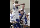 Swanville’s Bennett Primus prepared to go up for a shot while LPGE’s Matt Roe went for a block.