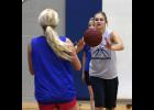 Haileigh Sales made a pass to Crystal Kaun during a preseason practice. Sales is one of just two seniors on a young Bulldogs squad this season.