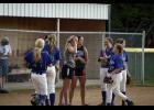Swanville head coach Paige Beseman high fived sophomore second baseman Becca Taylor as the team huddled up after an inning in the field during last Tuesday’s playoff game in Browerville.