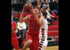 Cody Rahn went up for a layup after driving to the basket against Isle.