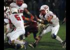 USA’s Eric Koetter (5) and Dylan Graves (28) combined for a tackle of a Royalton ball carrier. Graves finished with a team high 18 tackles.