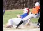 USA senior Troy Evans was able to avoid the tag as he slid into home plate in Friday’s game against Ogilvie.