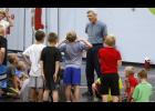 Peterson spoke with the youth wrestlers before they hit the mats during the grades 3-6 morning camp session last week.