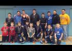 Front row from left: WCA wrestler, WCA wrestler, Carter Meiners, Omar Zamora, Braden Thom, Cael Lorentz, Shawn Houdek, Chace Lorentz (manager). Back row from left: Joseph Middendorf, Coach Matt Stacey, Hans Holmquist, Adam Lindquist, Landon Gode, Trey Lancaster, Coach Nate Pachan, Coach Tim Zastrow.