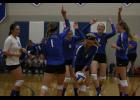 From left: Emily Beseman, Brooklyn Thieschafer, Madison Beseman, Sophie Larson, and Crystal Kaun celebrate a point during their 3-0 win over Isle last Tuesday.