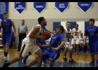 Swanville senior Cole Pfeiffer (R) stepped in to attempt to take a charge on Browerville/Eagle Valley’s Jordan Gorder as the junior forward drove to the hoop.