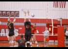 Kaelyn Walker sent a kill over the net against the Tigers.