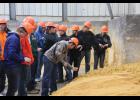 Students get to see and feel the texture of wet distillers grain.