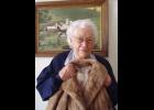Elsie Keller of Long Prairie with the fur coat her husband Wendelin surprised her with one Christmas. Photo by Jan King
