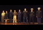 Members of the Blivet Players and soloists line up for the opening of the USA Community Chorus’ Veterans Day show. They are (L-R) Fr. Michael Kellogg, USAF TSGT Maureen Putnam, USAF TSGT Tom Speckhard, MnANG CW4 Scott Bjerke, USAF CPT Tony Foster, MnANG MAJ Neal Wilson, USN LCDR Graham Clark and USMC LTC Richard Vosepka.